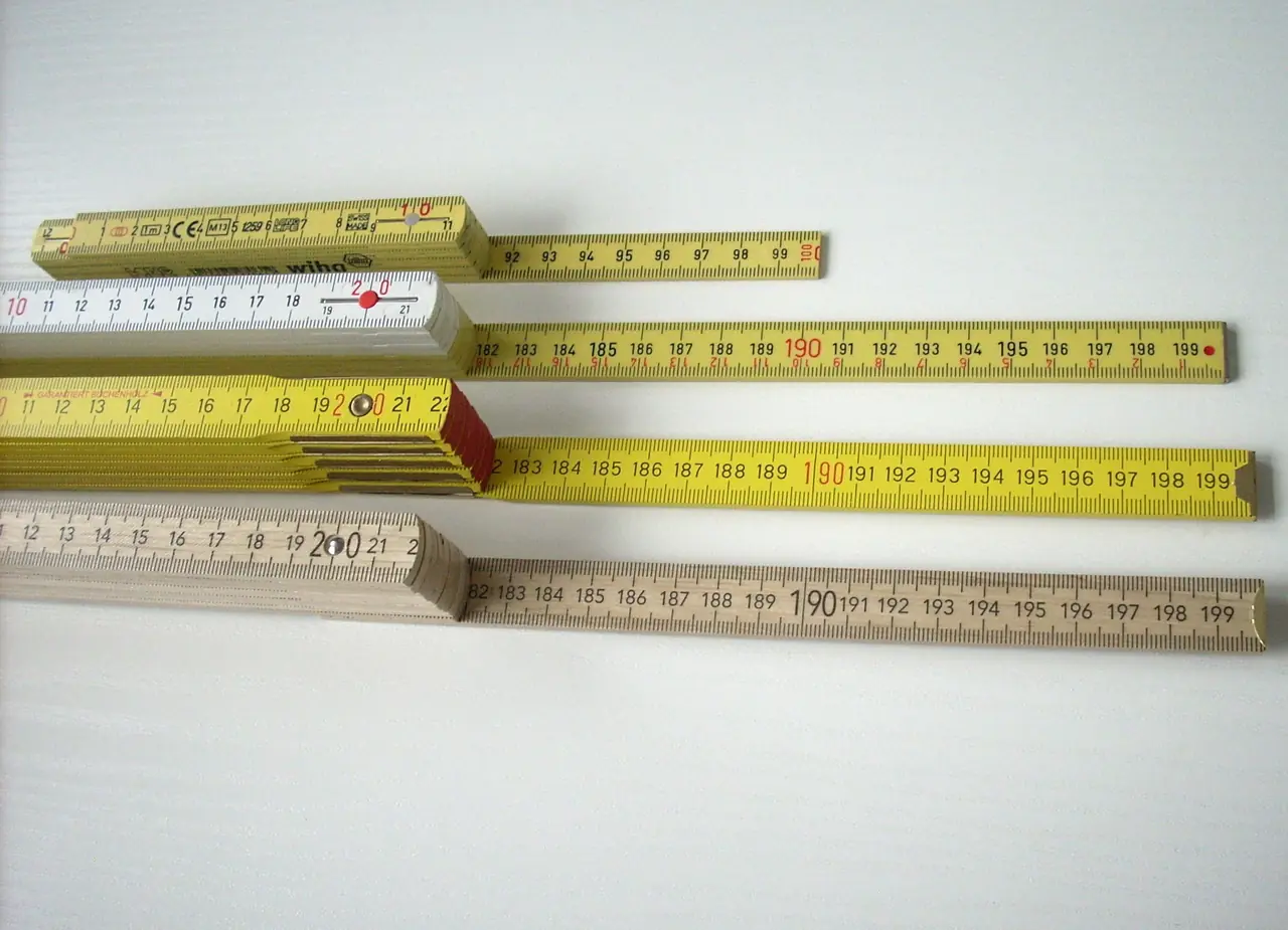 Four folding rules with a centimetre scale
