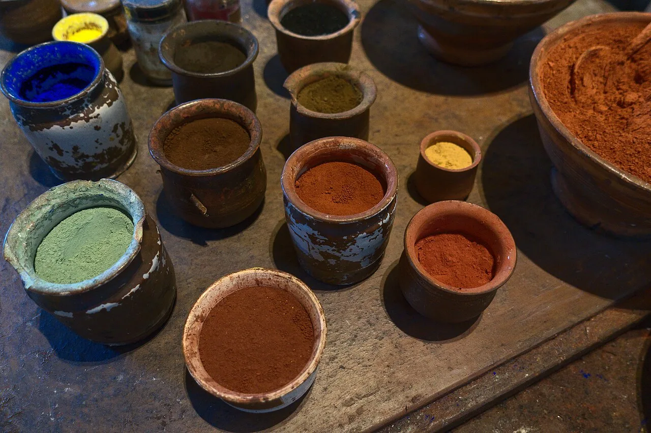 Clay pots filled with powdered pigments in a range of colors