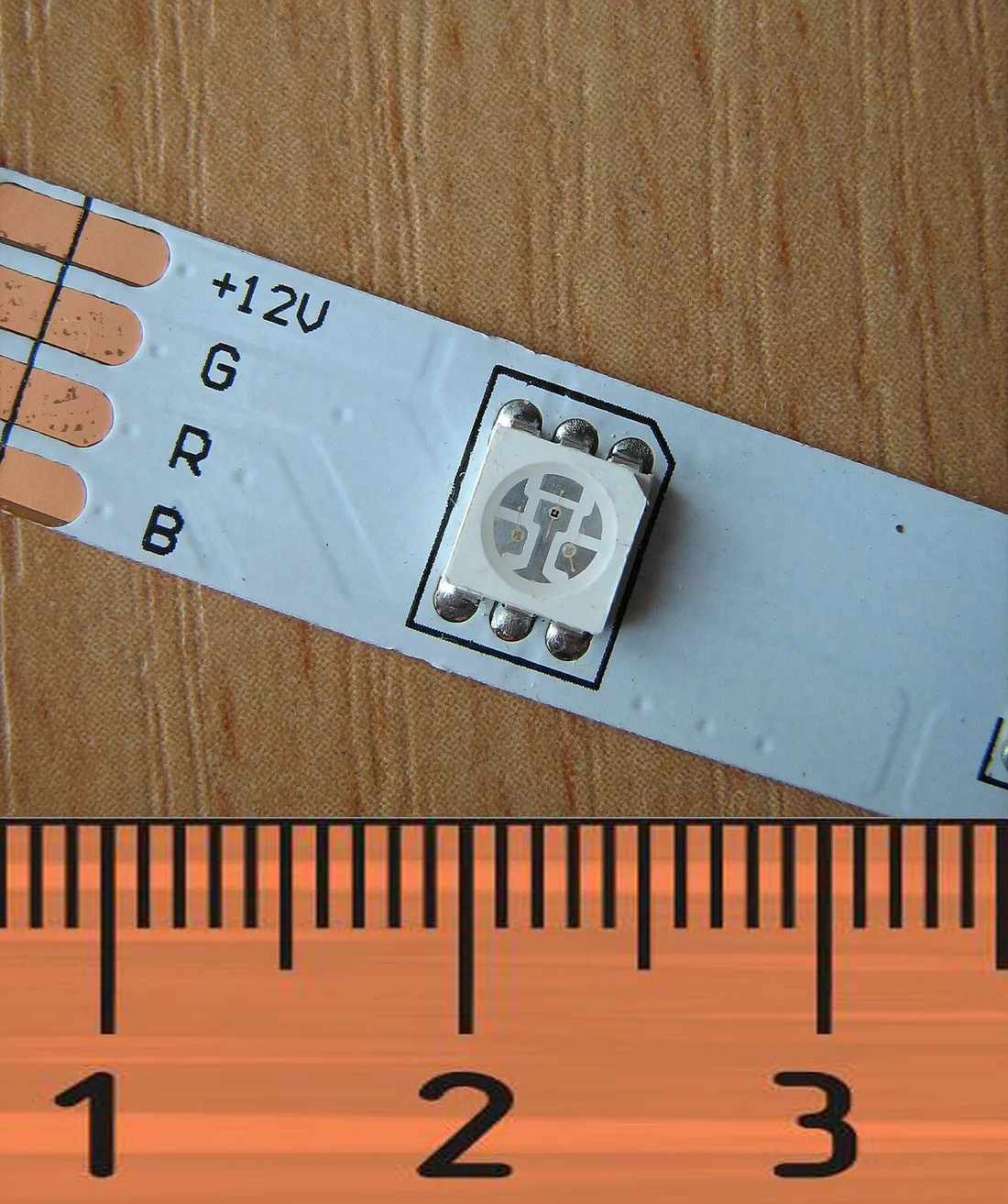 An RGB LED on a strip, with contacts marked R, G and B