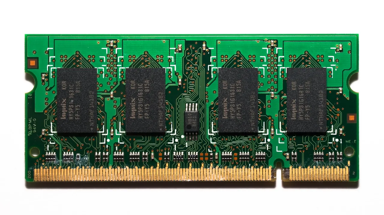 A laptop RAM module with four chips on the board