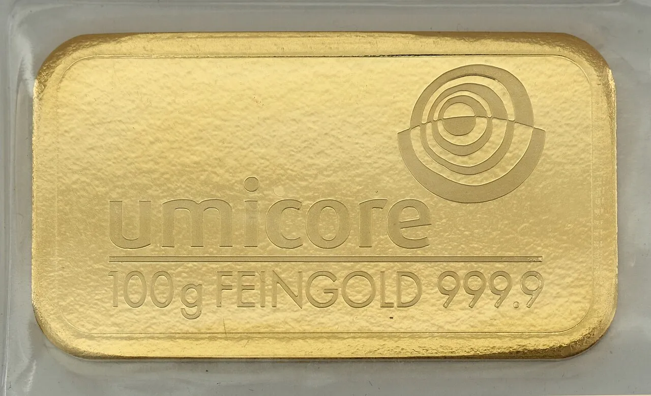 Investment gold bar stamped 100 g Feingold 999.9 in a sealed clear pack