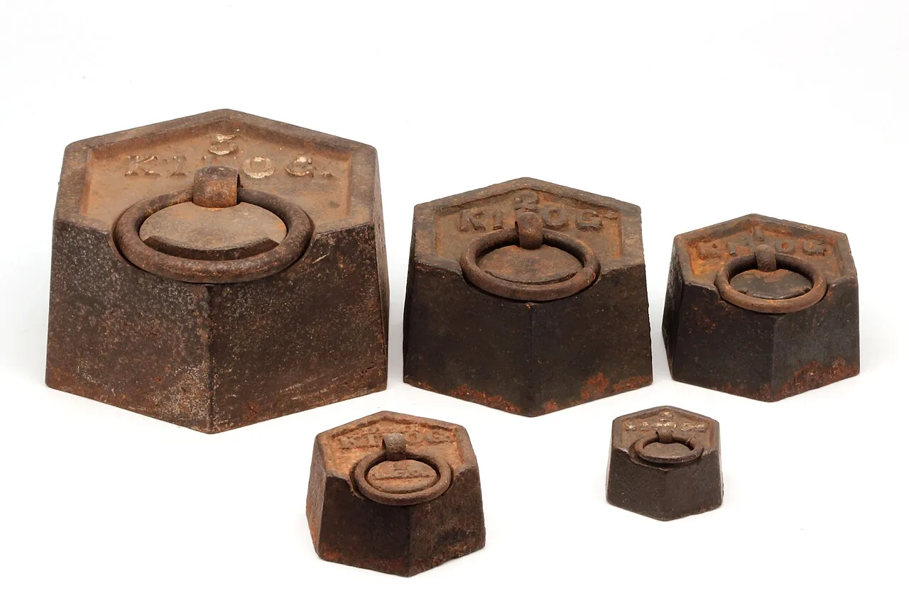 Cast-iron weights ranging from five kilograms down to two hundred grams