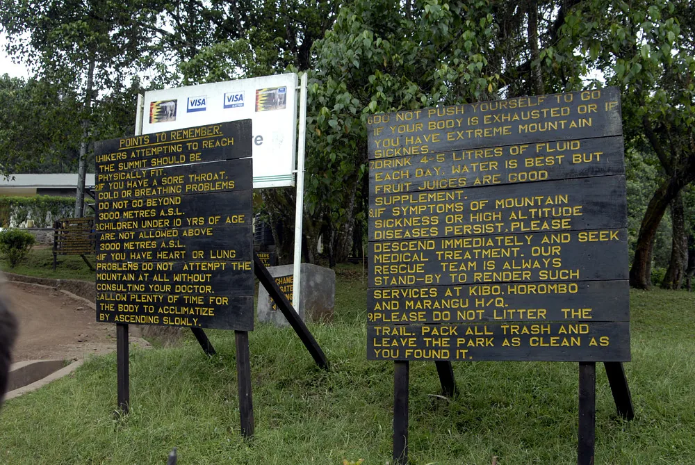 Warning boards at the Kilimanjaro gate stating the altitude in metres