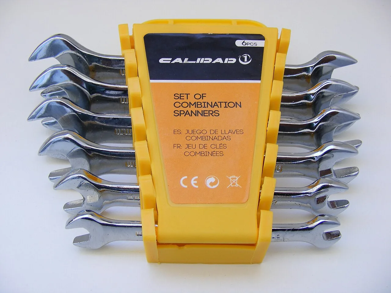 Set of six combination spanners in a yellow holder
