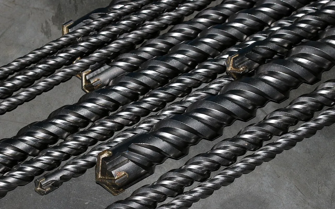 Close-up of several masonry drill bits lying side by side